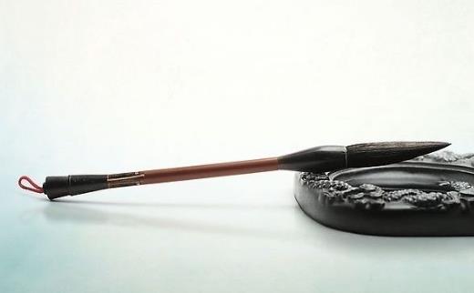 中國傳統的書寫工具毛筆是誰發明的